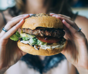 person holding a burger