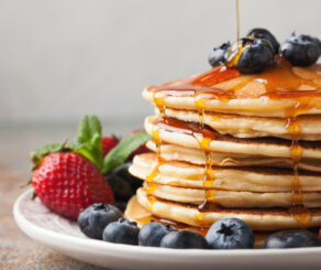 Pancakes with berries and syrup