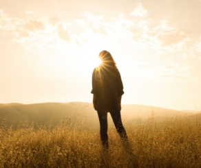 woman looking at sunrise